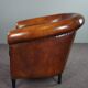 Club armchair in sheepskin with black piping