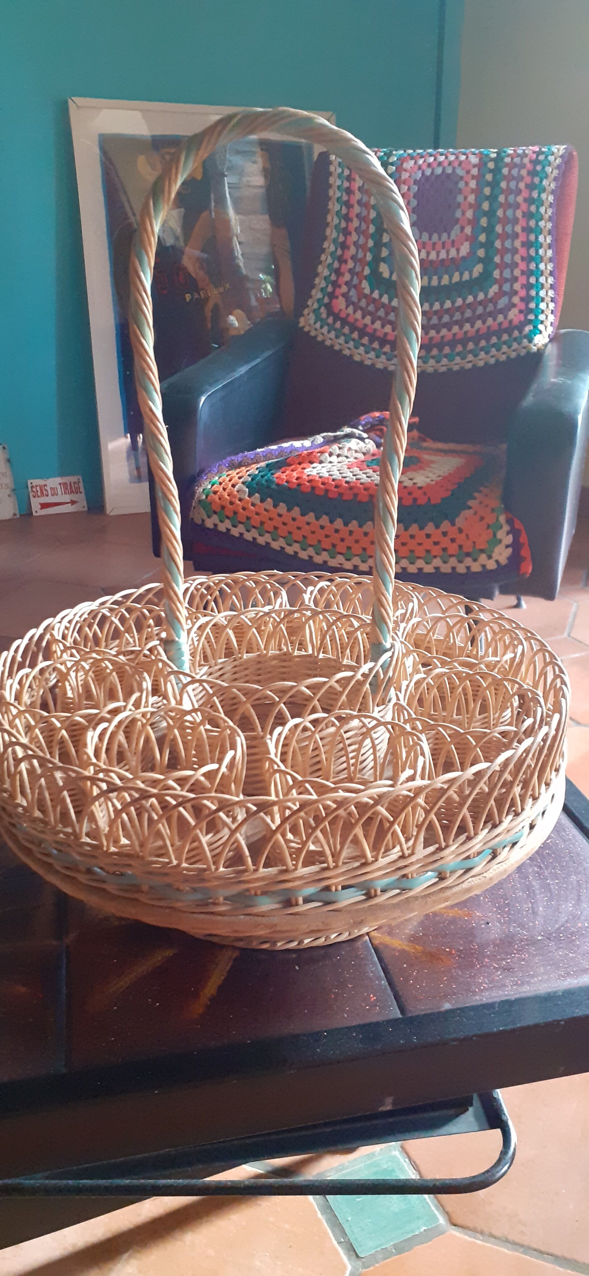 Glass holder and wicker bottle with green plastic water surface