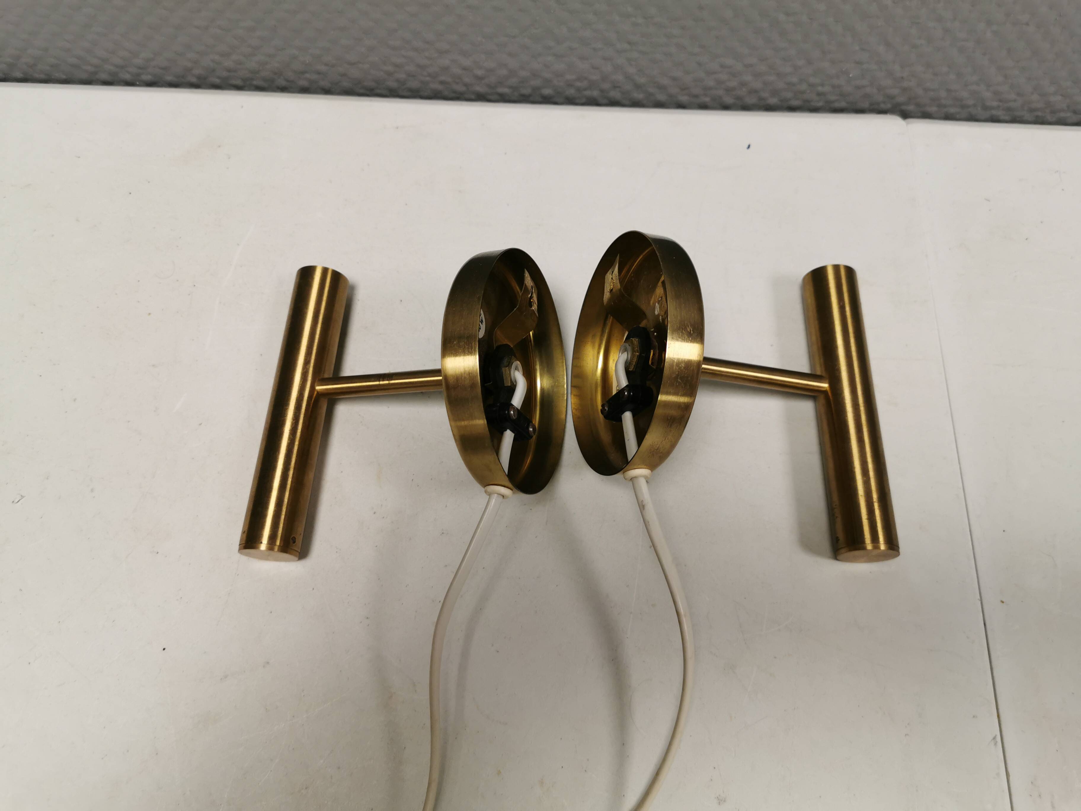 A set of stylish brass wall lamps from Danish Darø