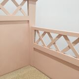 Vintage old pink wooden baby bed