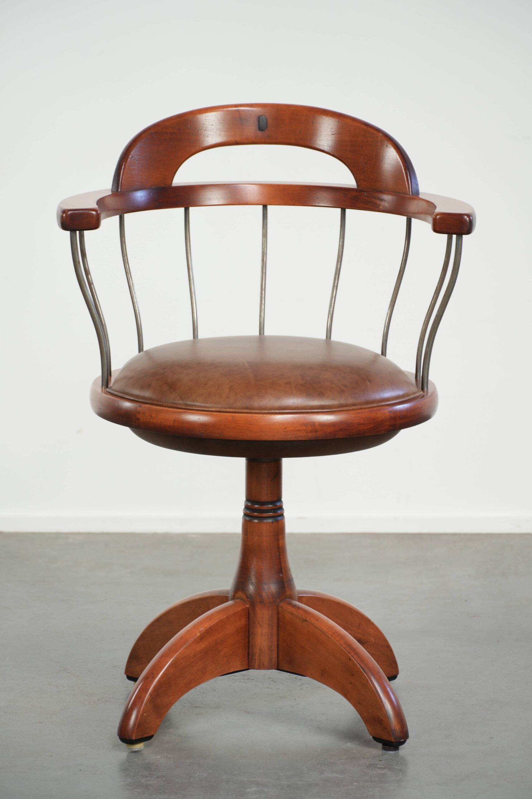 Swivel side chair / office chair with a cognac-coloured cow leather seat