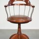 Swivel side chair / office chair with a cognac-coloured cow leather seat