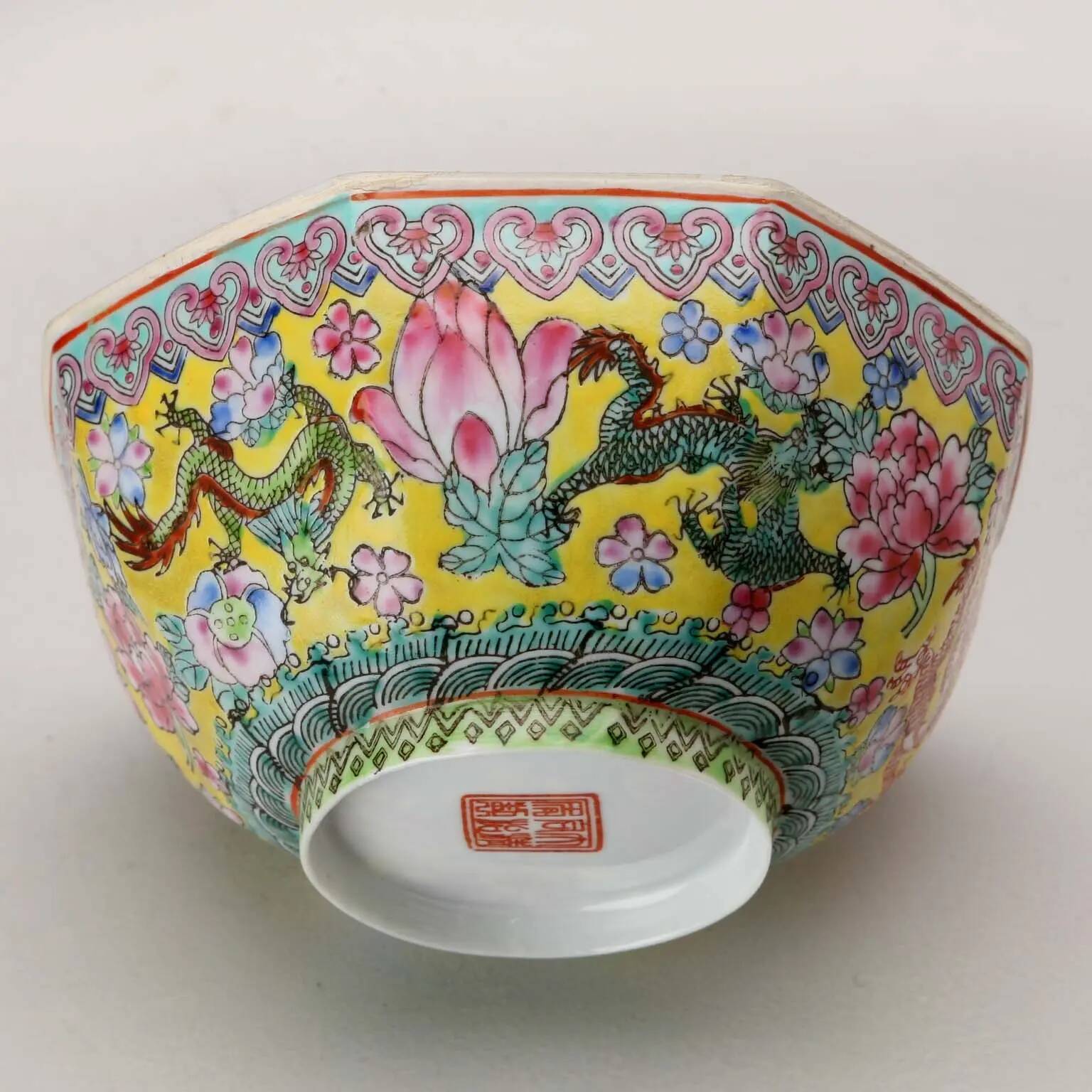 Vintage porcelain bowl decorated with dragons and flowers, China, 1980s.