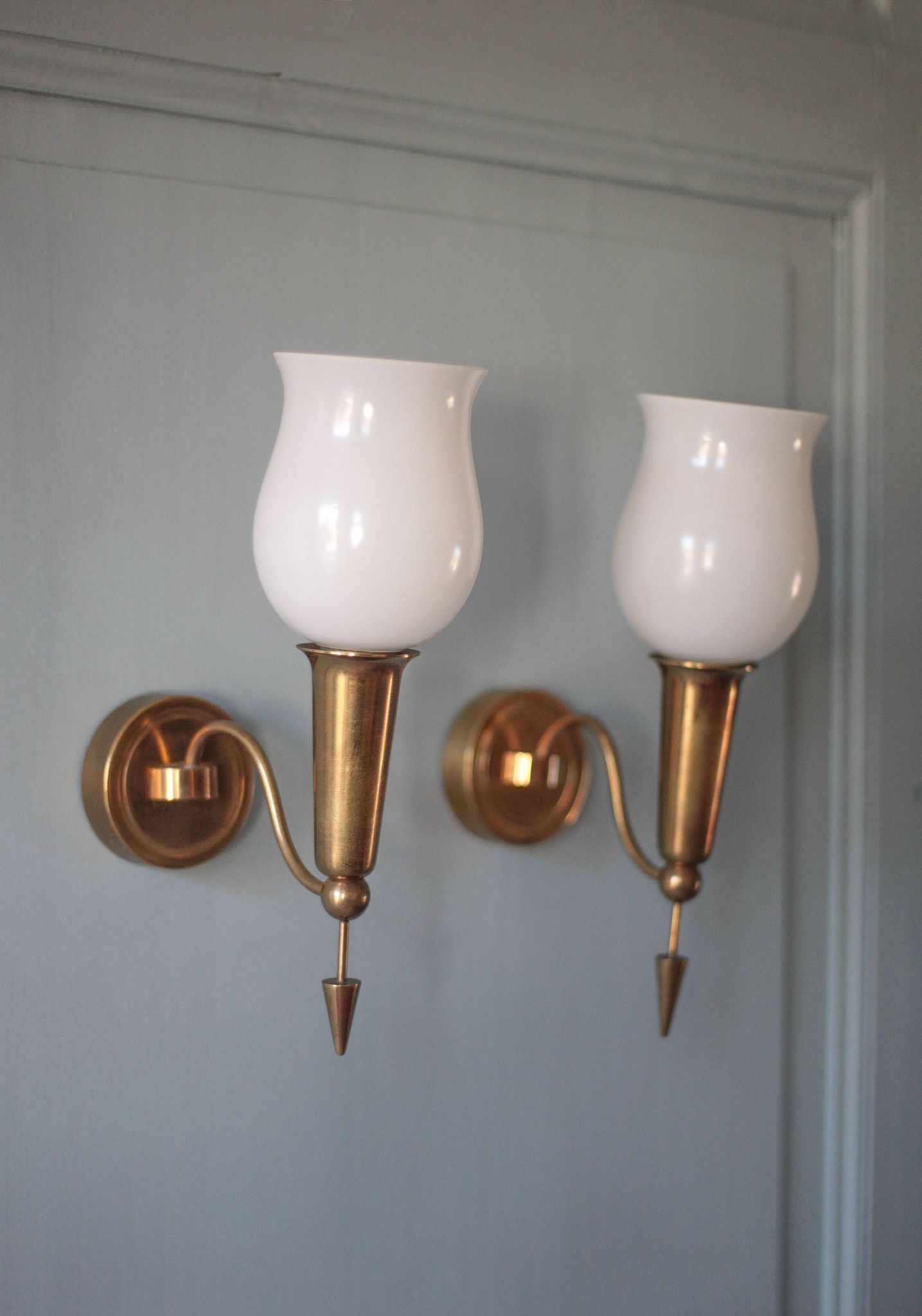 Pair of gold metal and white opaline wall sconces, wall light, sconce.