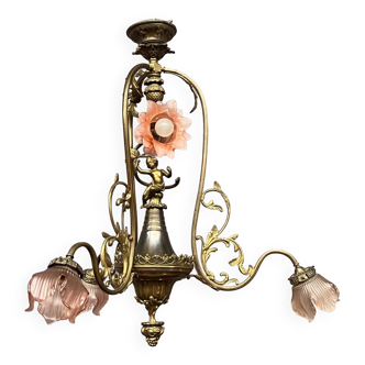 Renaissance chandelier with putti statuette.