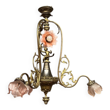Renaissance chandelier with putti statuette.