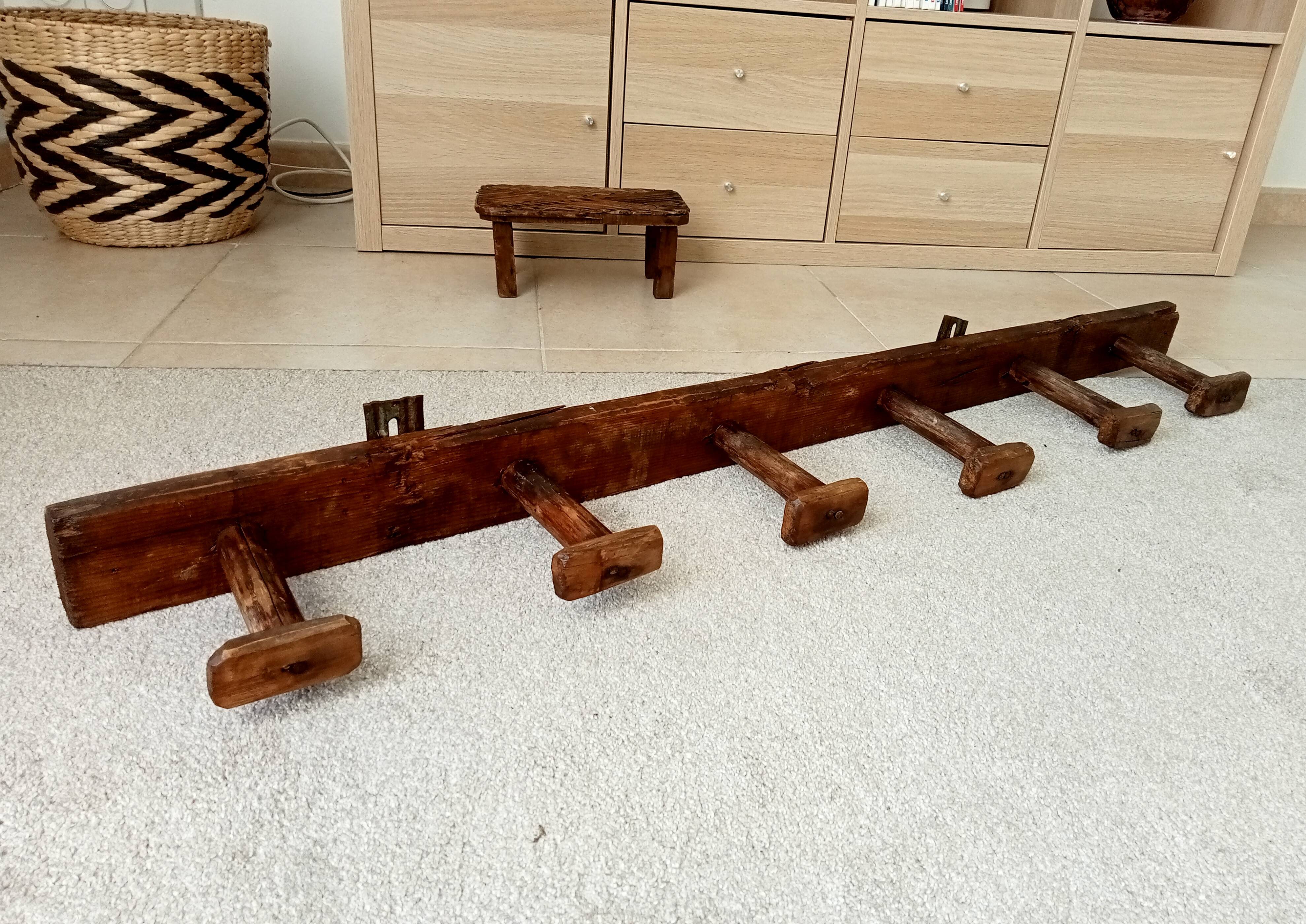 Old wall-mounted coat rack from a stable, folk art.