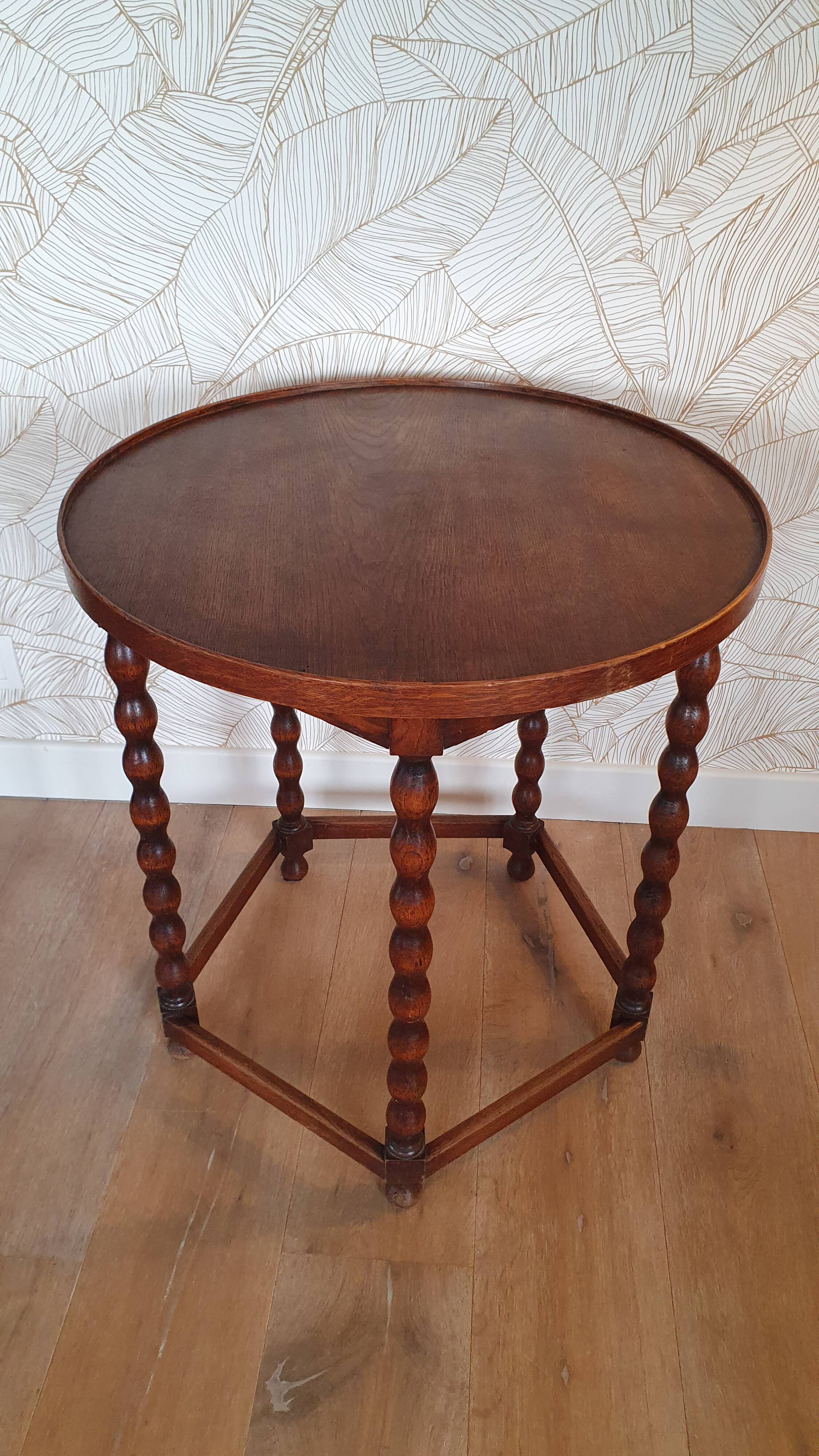 Round wooden table with beaded legs