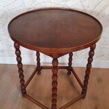 Round wooden table with beaded legs