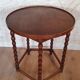 Round wooden table with beaded legs