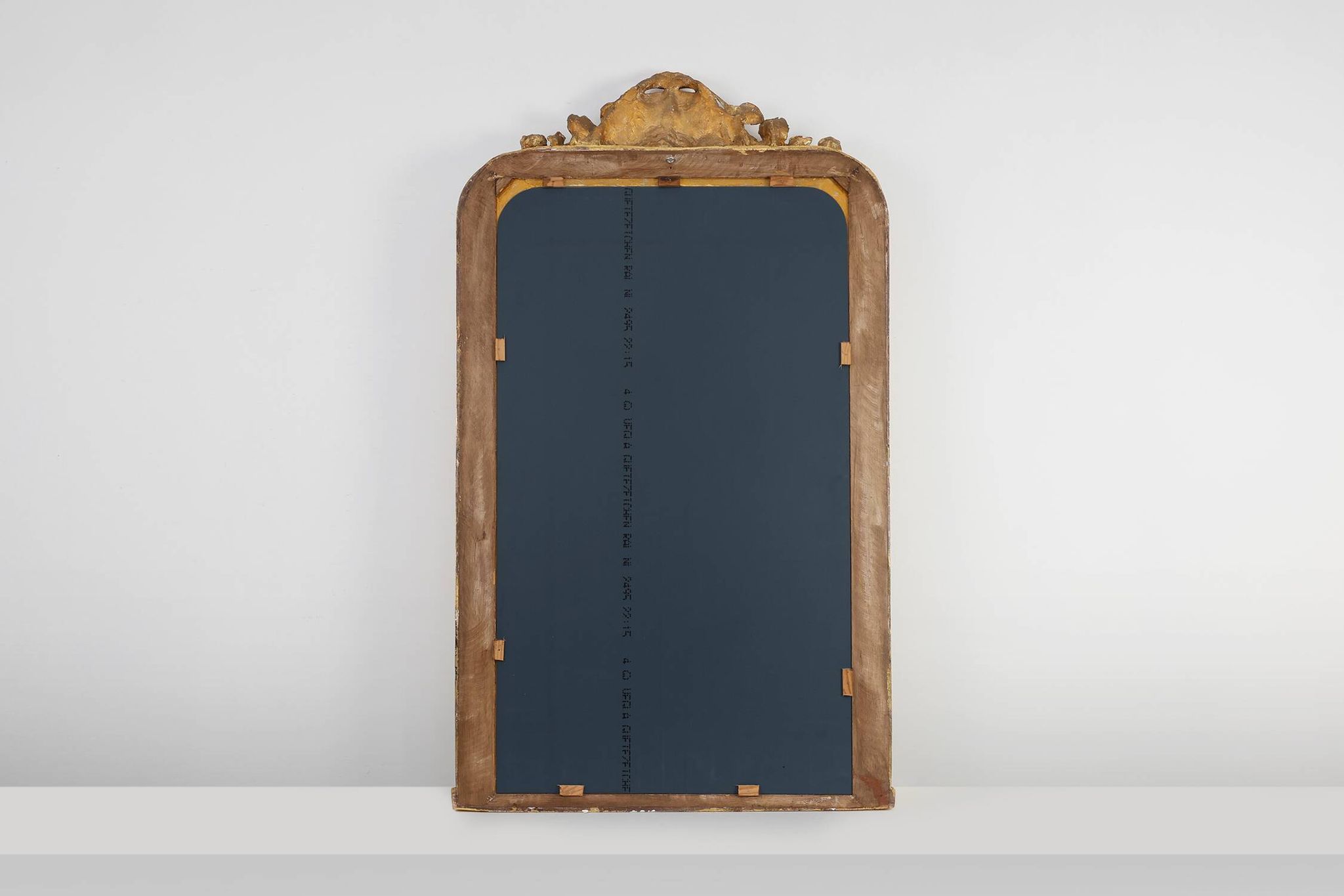 Baroque mantel mirror in carved wood and gilded plaster, France circa 1850.