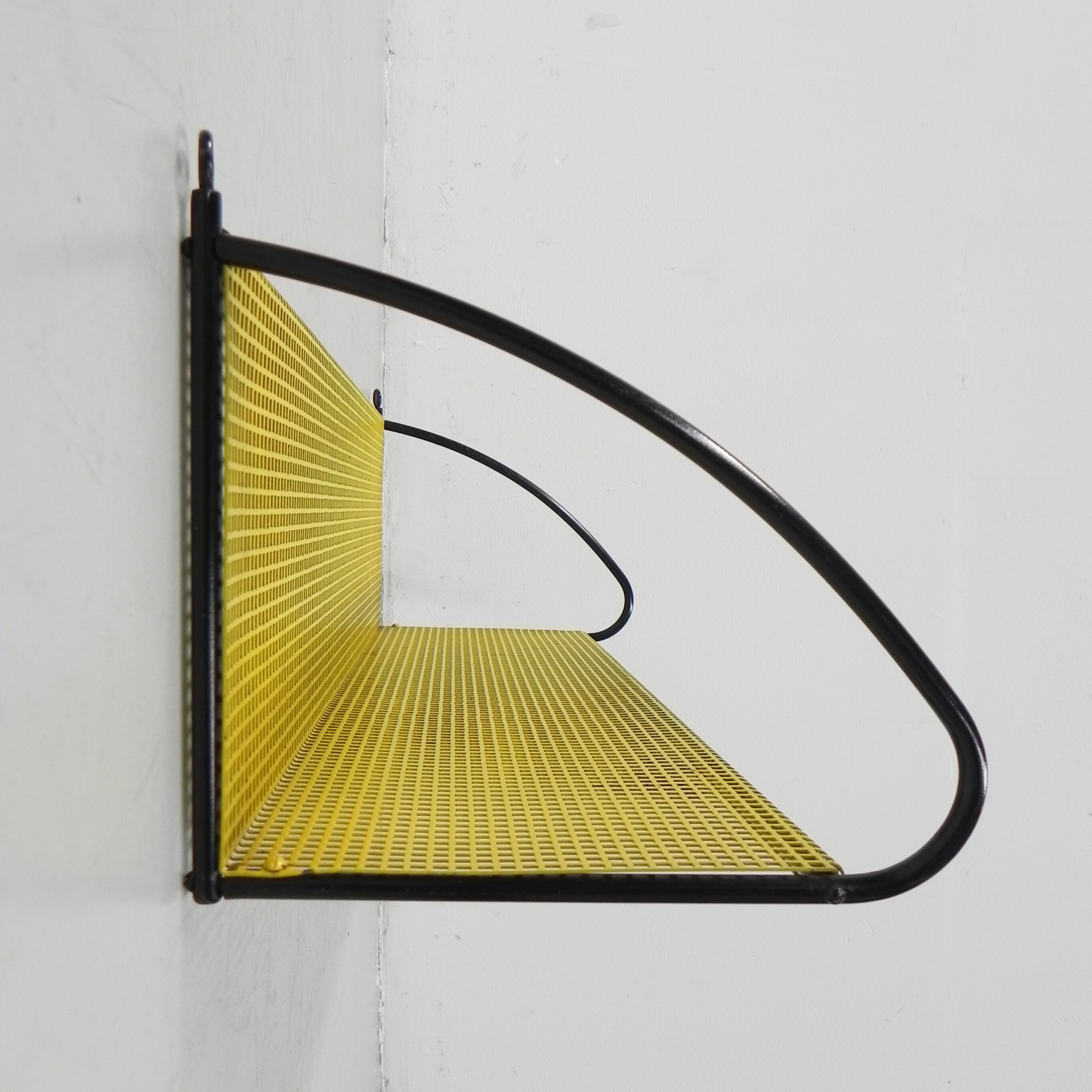 Pilastro wall rack with perforated steel plate