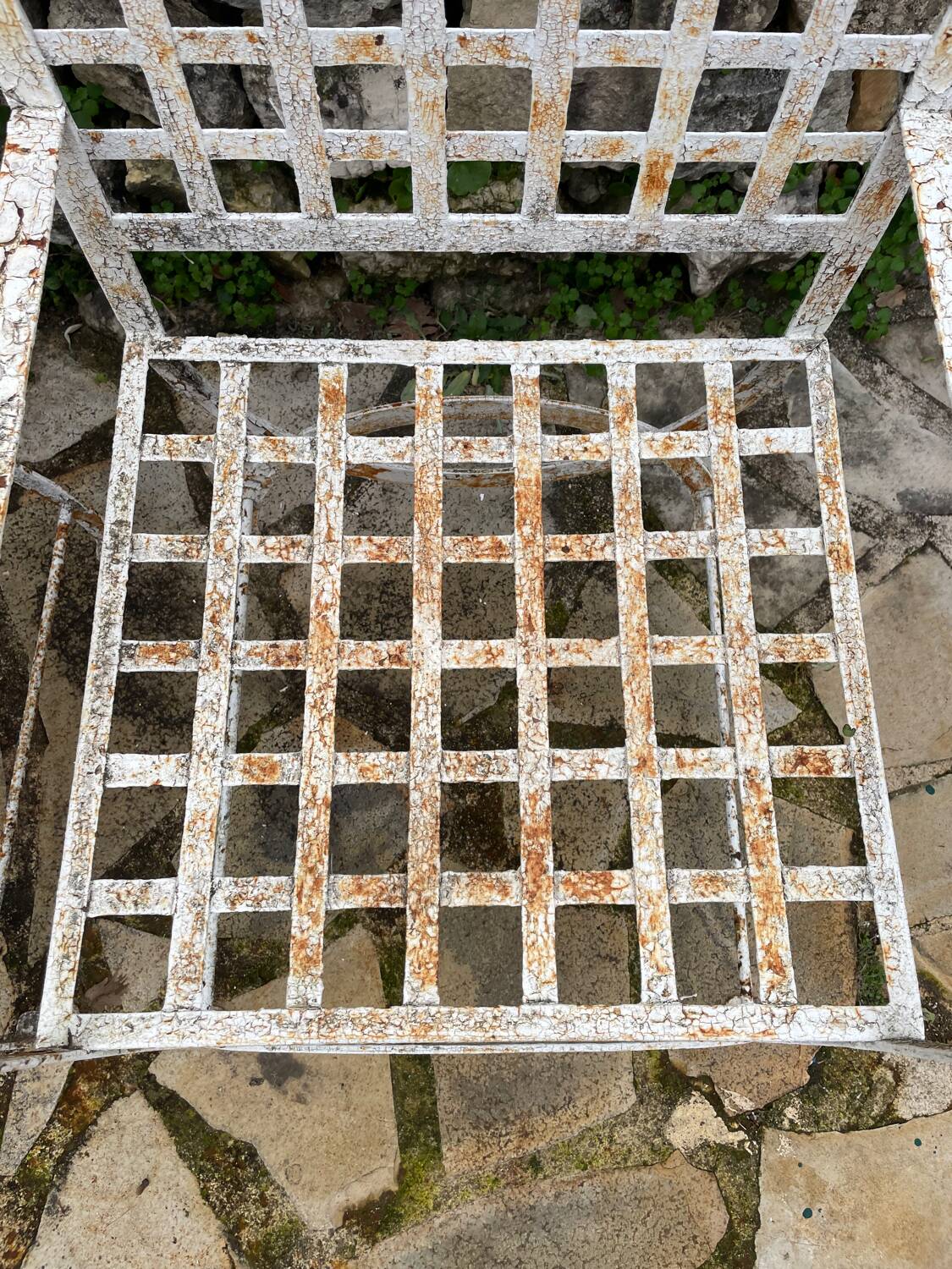 Pair of wrought iron armchairs