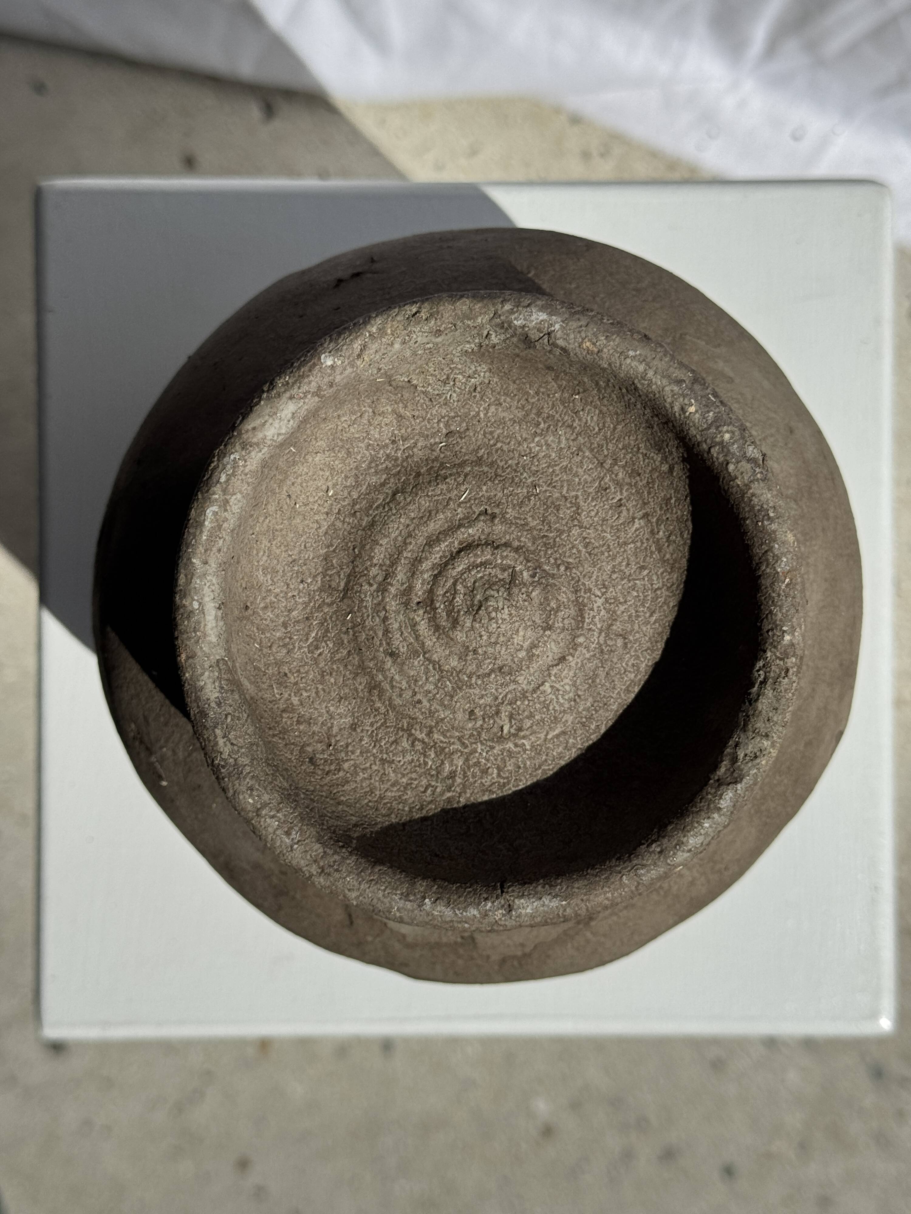 Small brutalist handcrafted terracotta vase with a pedestal, Indonesian, H19 D17.