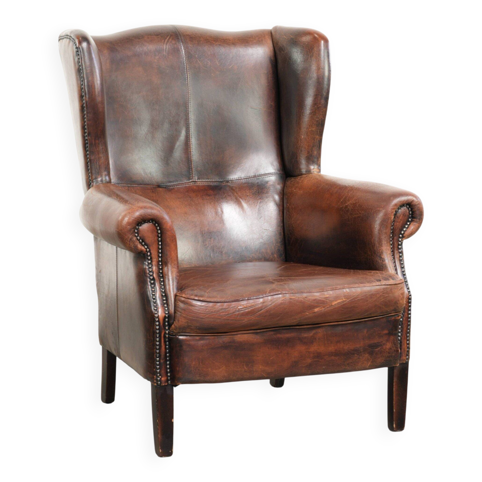 Vintage sheepskin wingback armchair in a deep brown colour finished