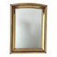 Art Deco mirror in gilded wood with curved floral decorations.