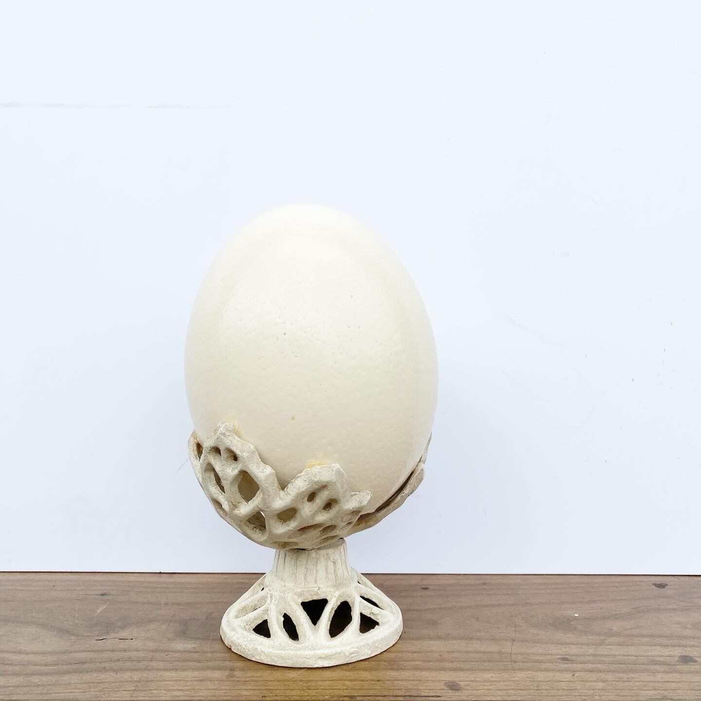 Ostrich egg on pedestal