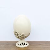 Ostrich egg on pedestal