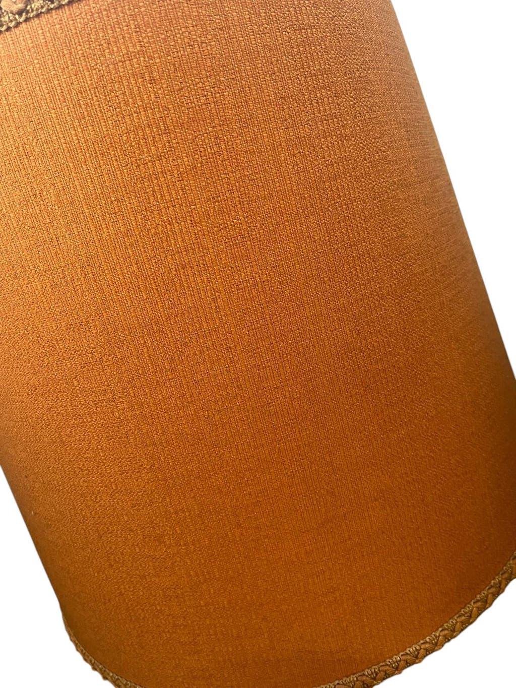 Vintage orange Portuguese table lamp with a ceramic base.
