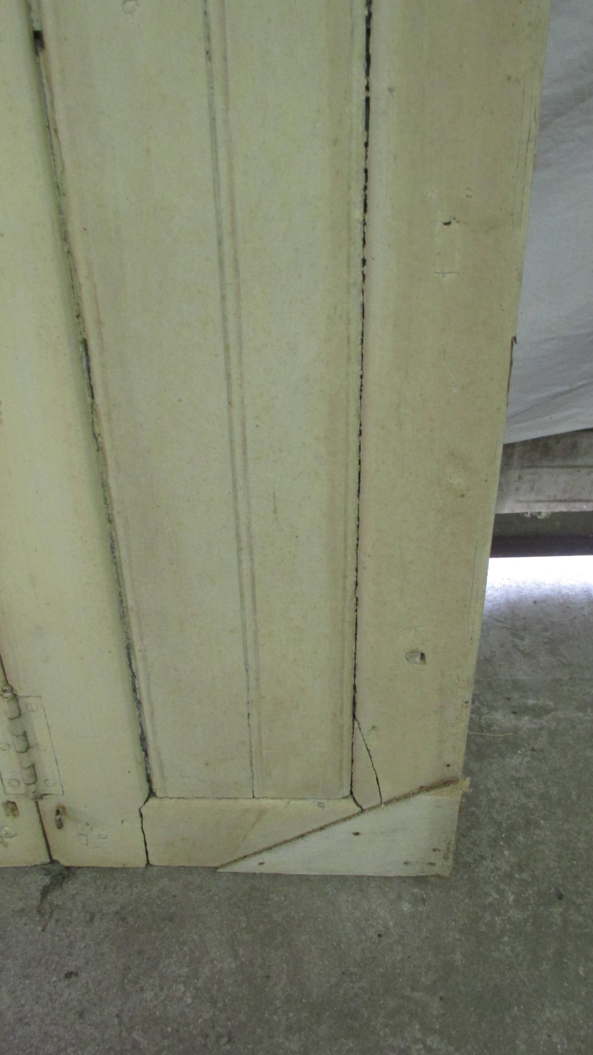 Old shutter in folding wooden louver