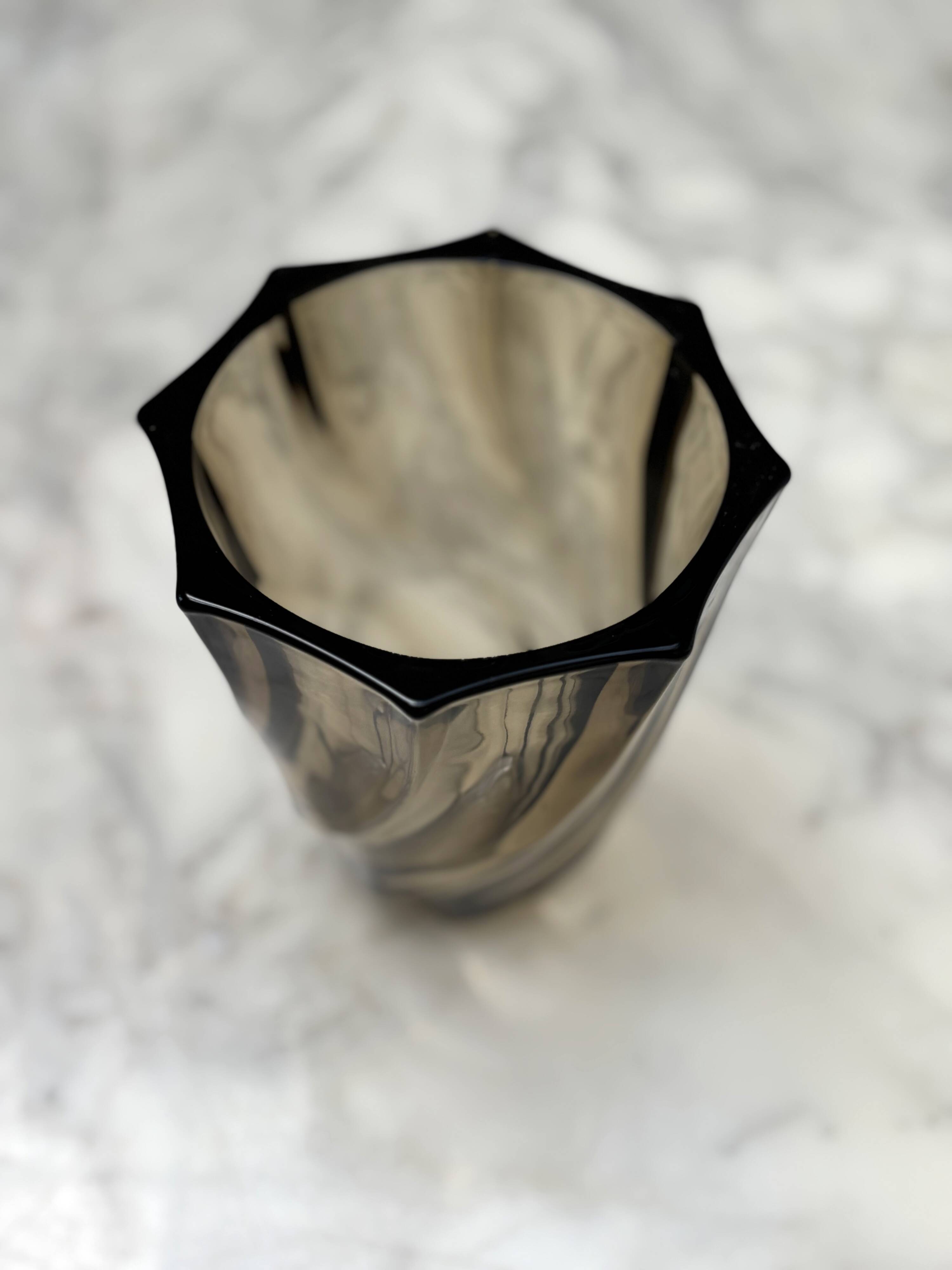 Small translucent dark brown twisted glass vase