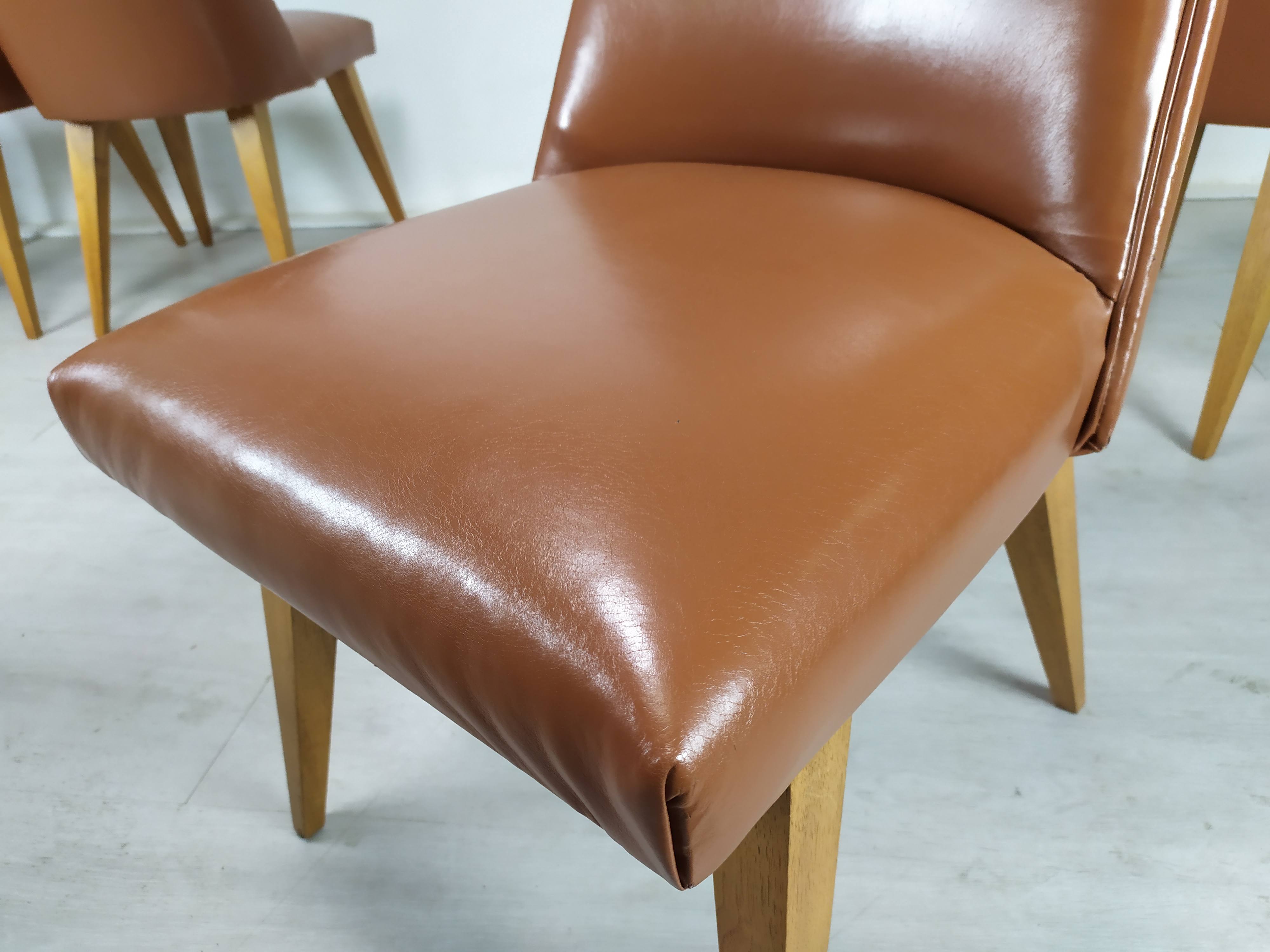 8 brown skai chairs 1950