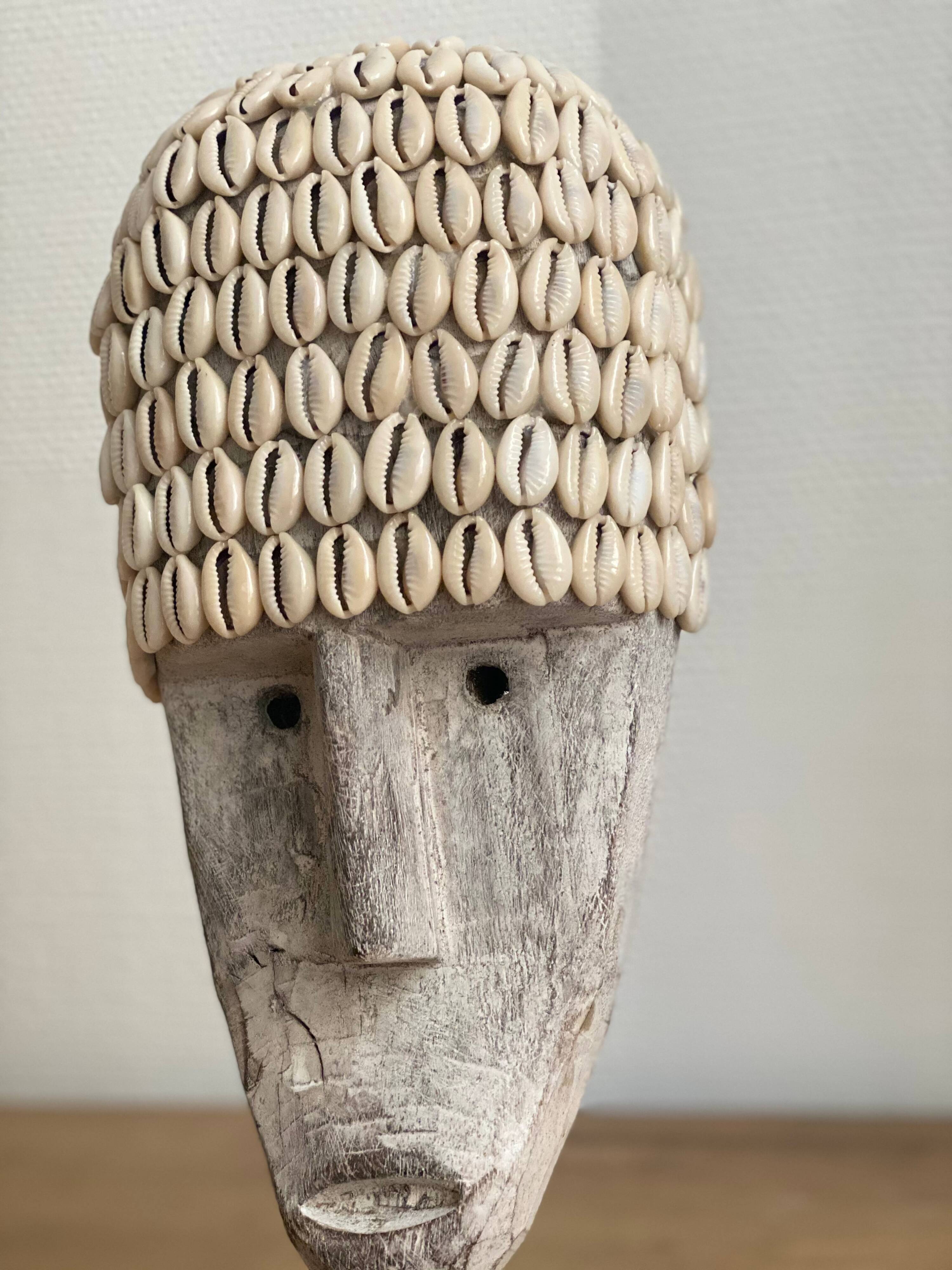 Wabi sabi face mask in aged wood and cowrie shells