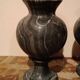 Pair of black serpentine marble vase-urns, early 20th century, Empire style