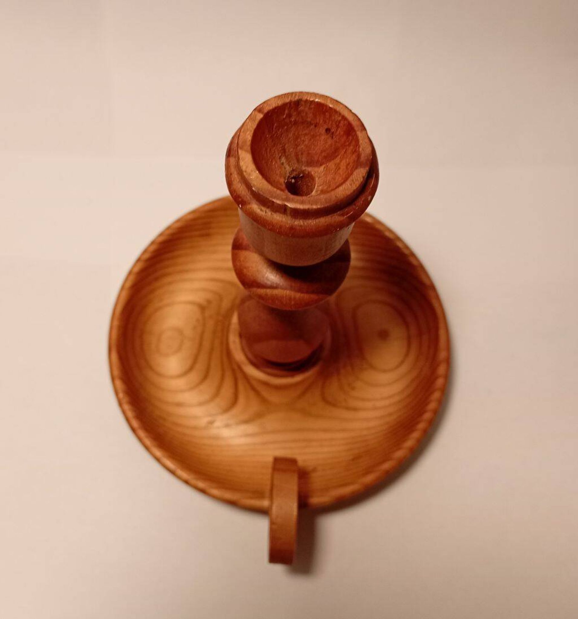 Vintage candlestick holder crafted from turned pine wood Scandinavian-style