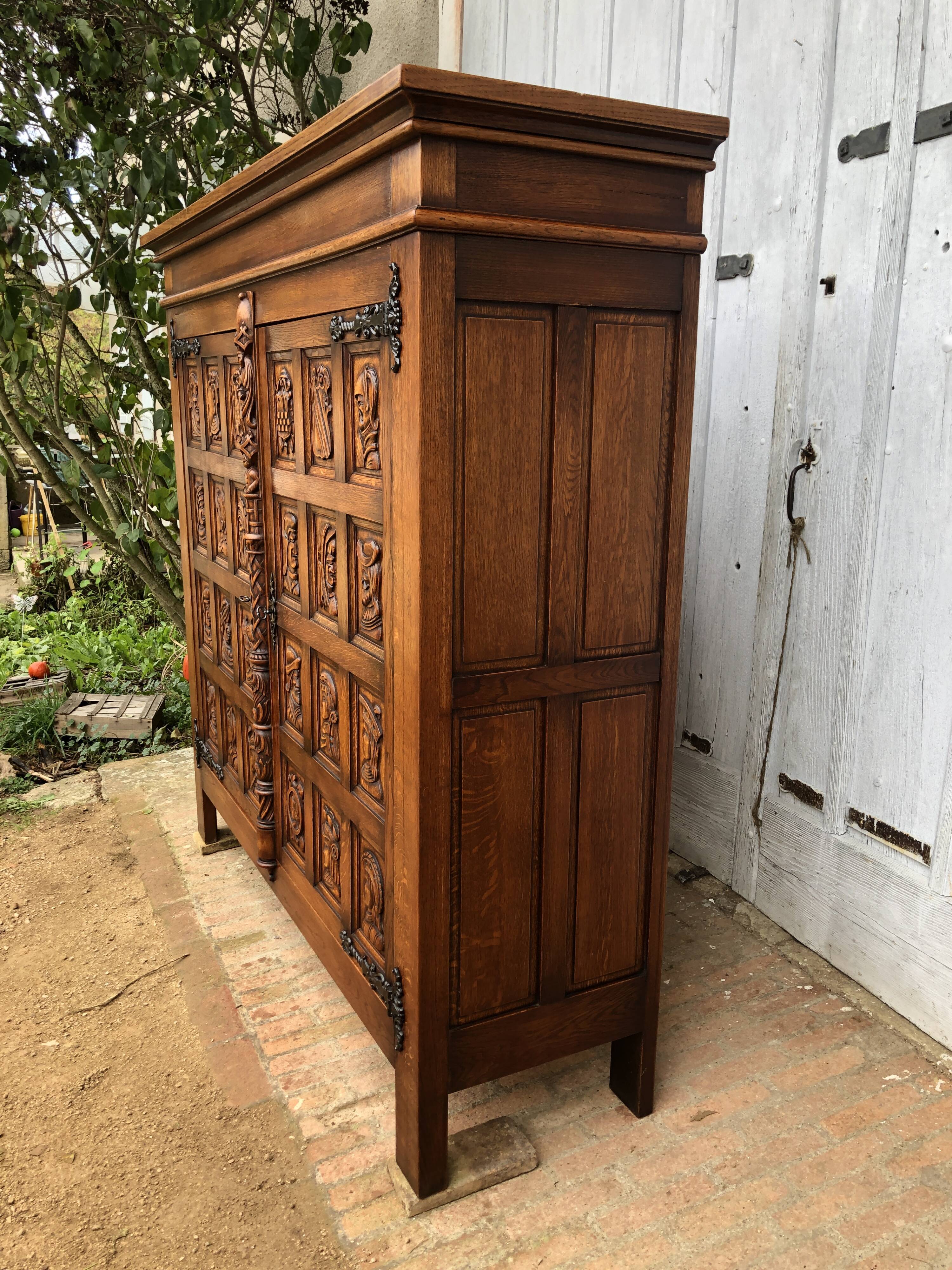 Spanish furniture with carved wood profiles and coats of arms from the 1950s.