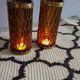 Photophores moucharabieh style candlesticks in brass and orange bubbled glass