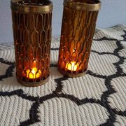 Photophores moucharabieh style candlesticks in brass and orange bubbled glass