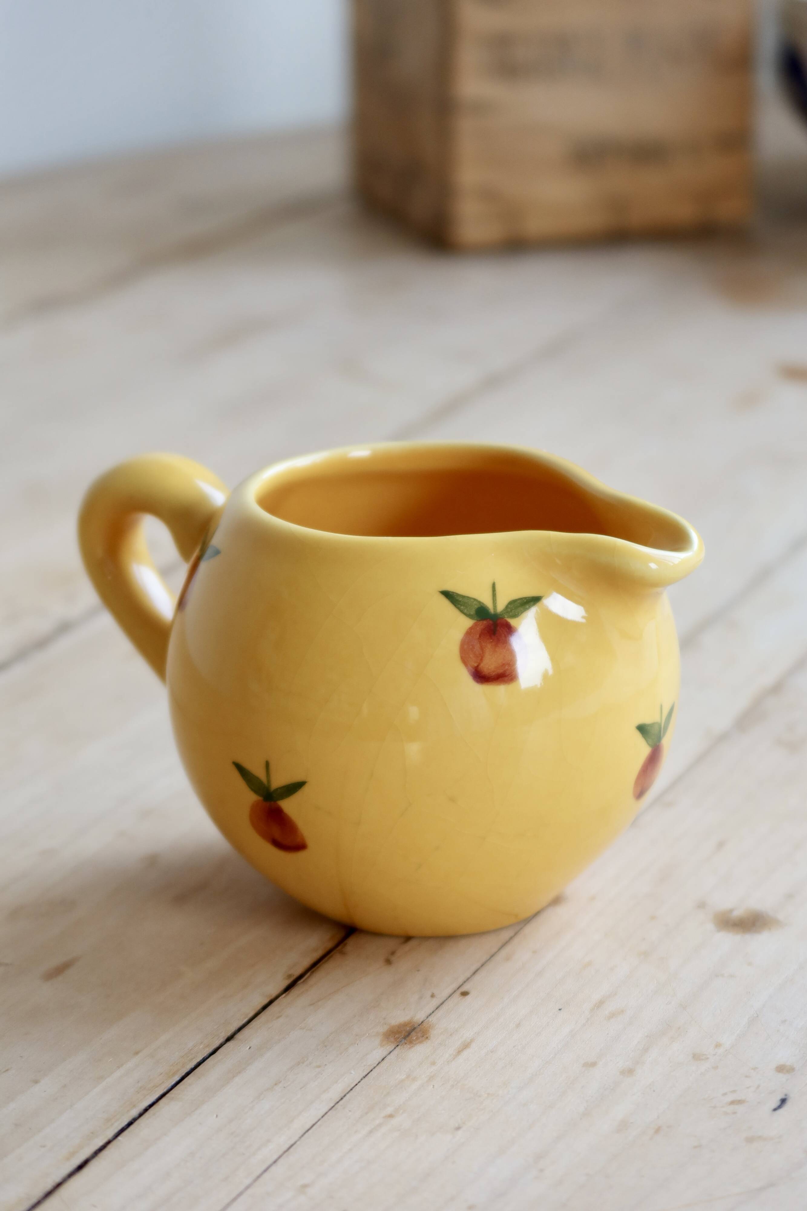 Vintage yellow ceramic milk jug