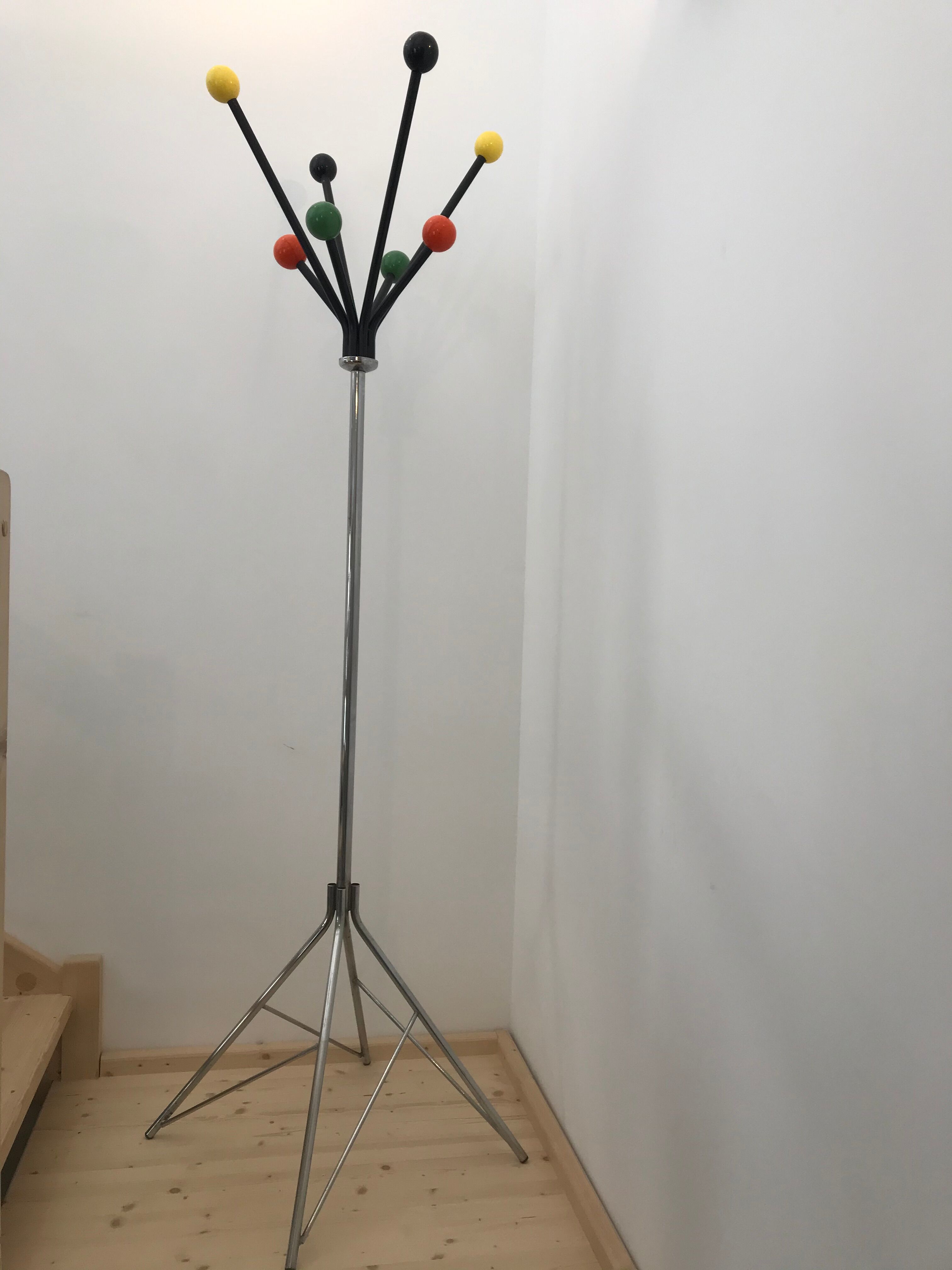 Wearing chrome parrot coat, black and multicolored balls