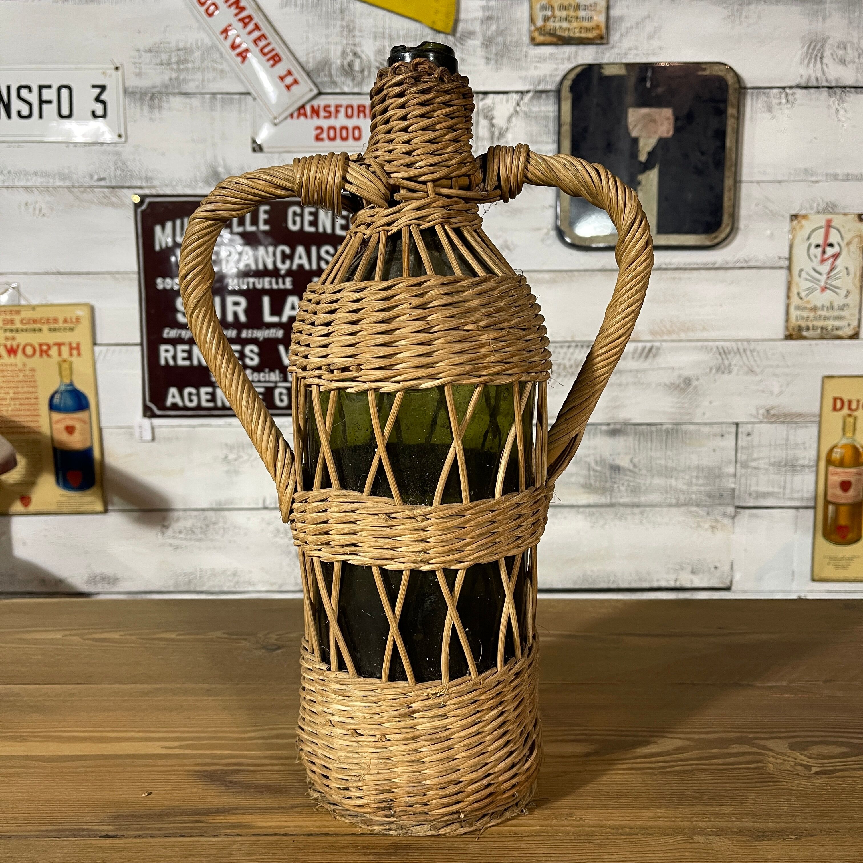 Braided wicker green bottle