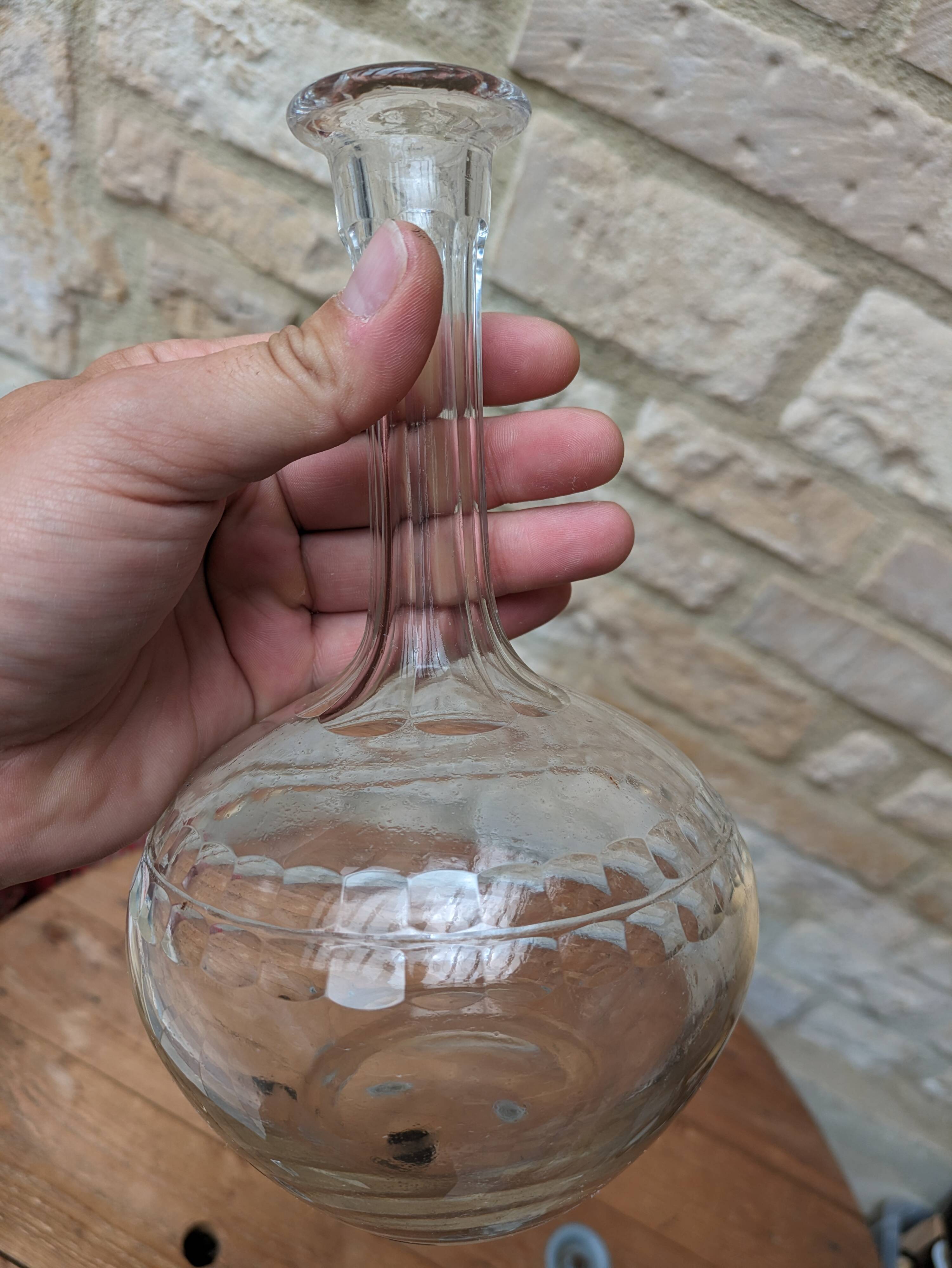 Antique round chiseled glass carafe with stopper