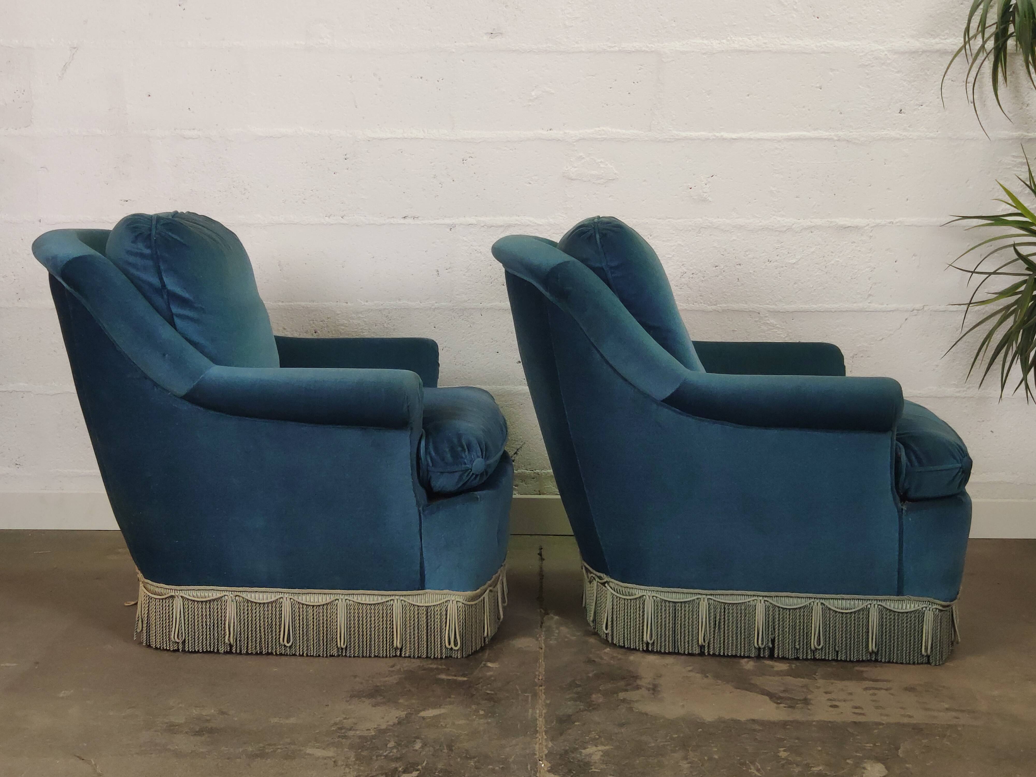 Pair of blue velvet armchairs with fringes