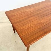 Teak dining table with integrated extensions — Scandinavian