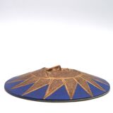 Relief mural signed in ceramic, sun with blue and gold face, 1990s.