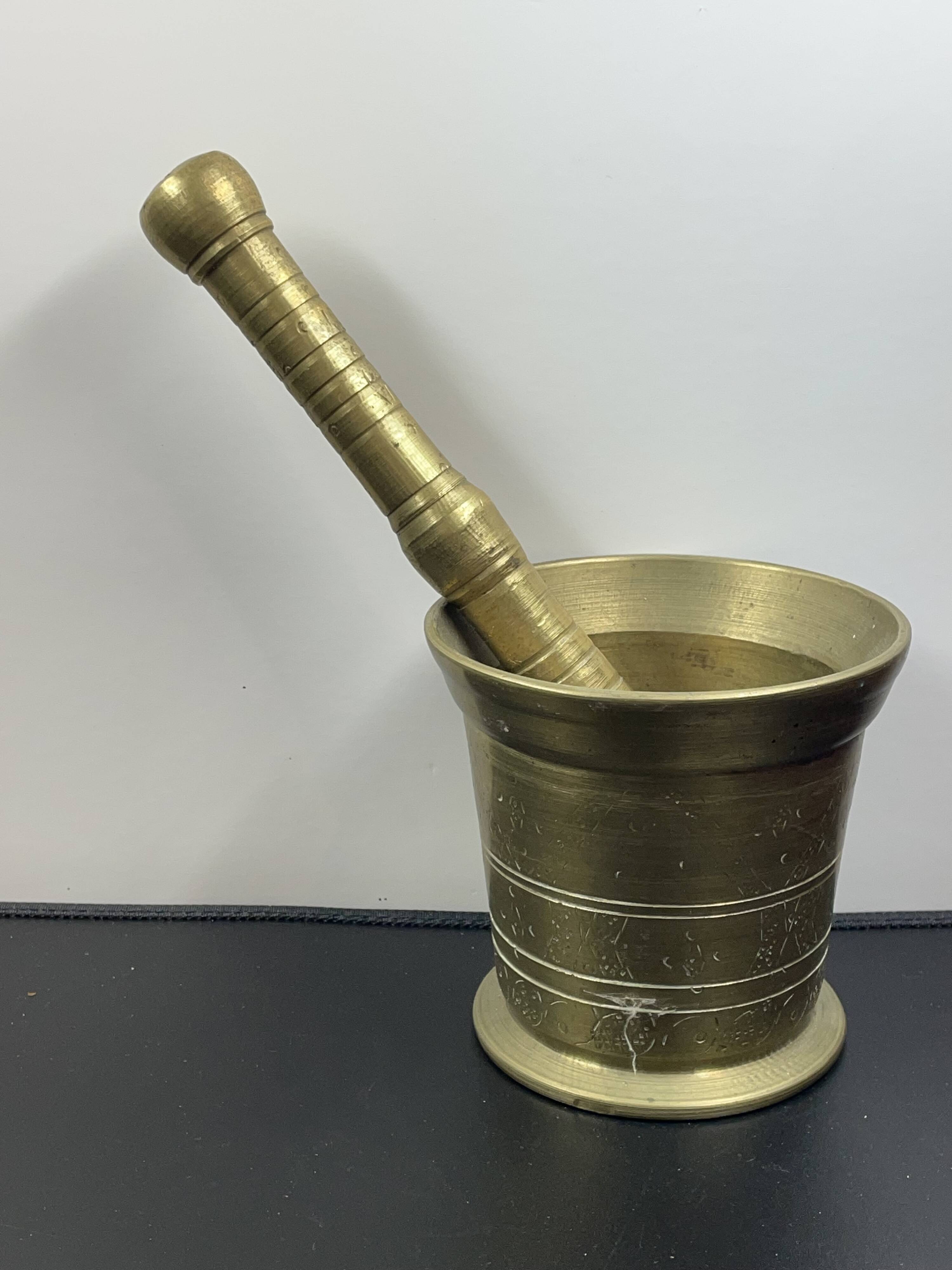 Large mortar & pestle. Chiseled bronze or brass metal, scarified decoration