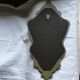 Gold and red mirror brand Deknudt