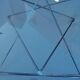 Tempered glass coffee table, intertwined legs design