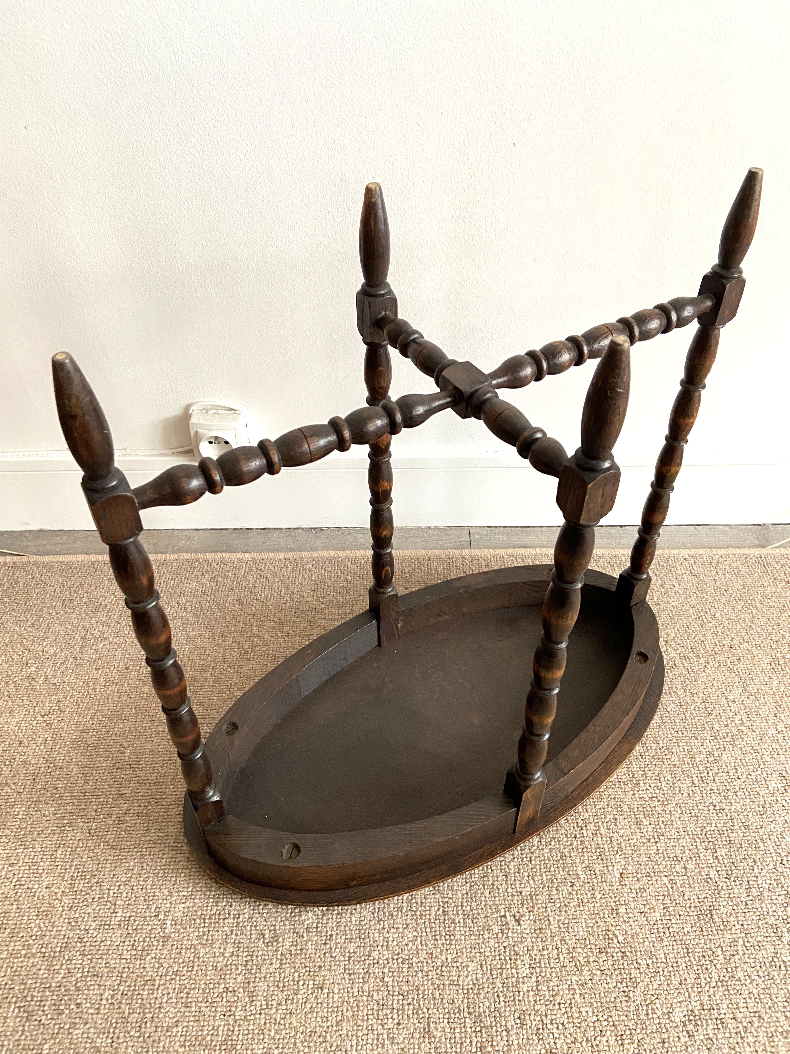 Oval wooden side table turned with spacer