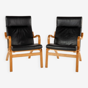 Pair of Scandinavian wood and black leather armchairs