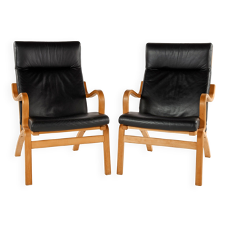 Pair of Scandinavian wood and black leather armchairs