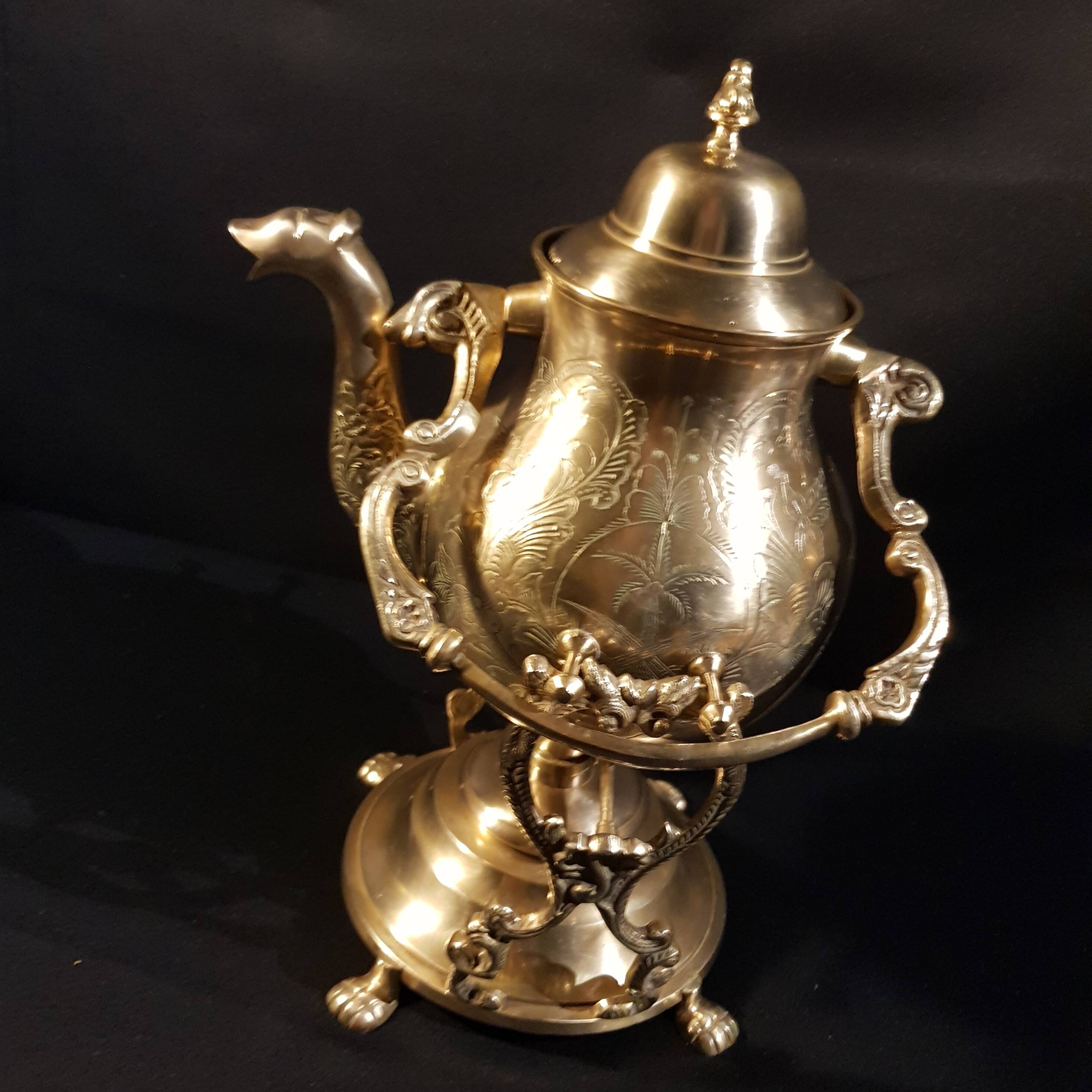 Oriental teapot on its support