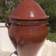 Large glazed terracotta jar, cognac colour with its lid.