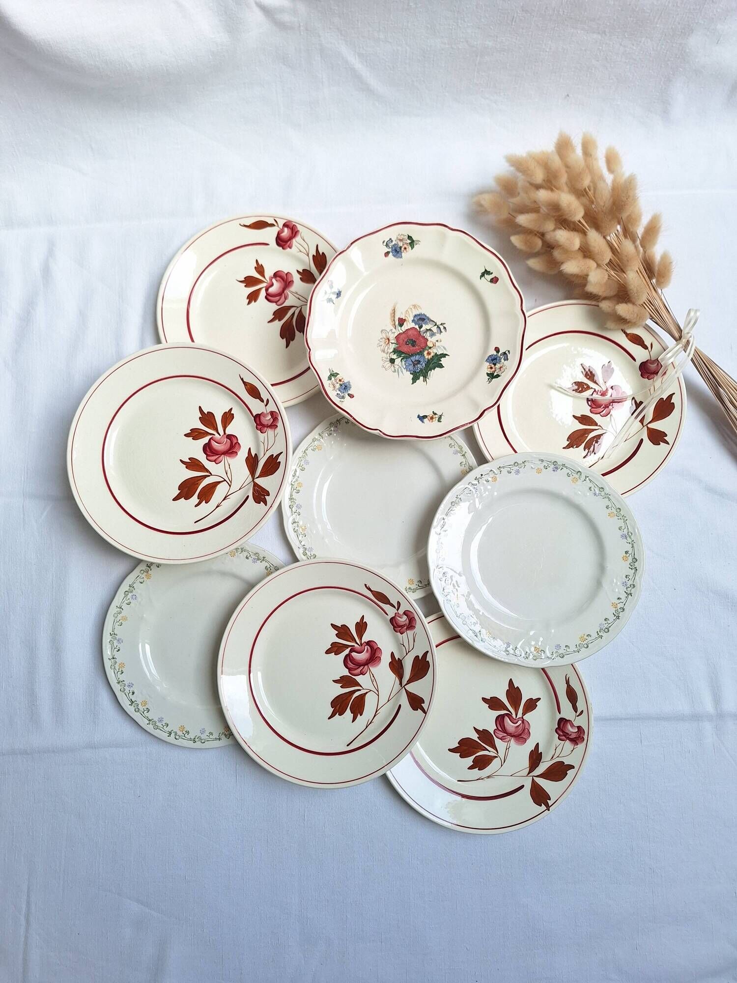 Vintage flower dessert plates from Sarreguemines, Longwy, and Lunéville.