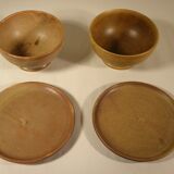 Two sandstone bowls and saucers