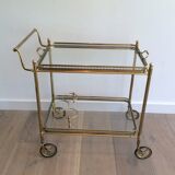 Neoclassical style rolling table in brass